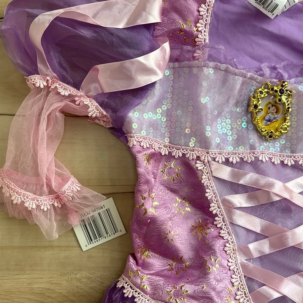 NWT Disney Princess Rapunzel Dress Up Dress. Girls Size M 7/8. Runs long. Pretty